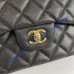 Chanel Jumbo Classic Flap Bag in Black Caviar Leather with golden hardware