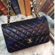 Chanel Jumbo Classic Flap Bag in Black Lambskin with golden hardware